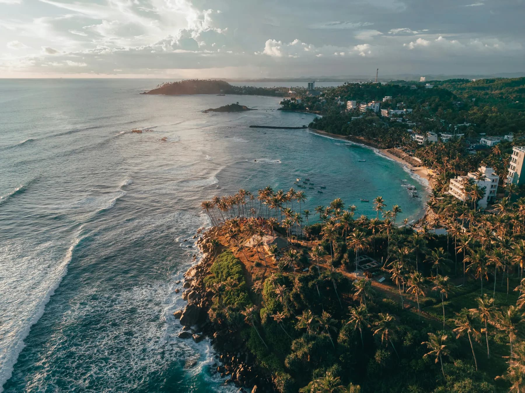 Coastal palm headland and turquoise waters of southern Sri Lanka